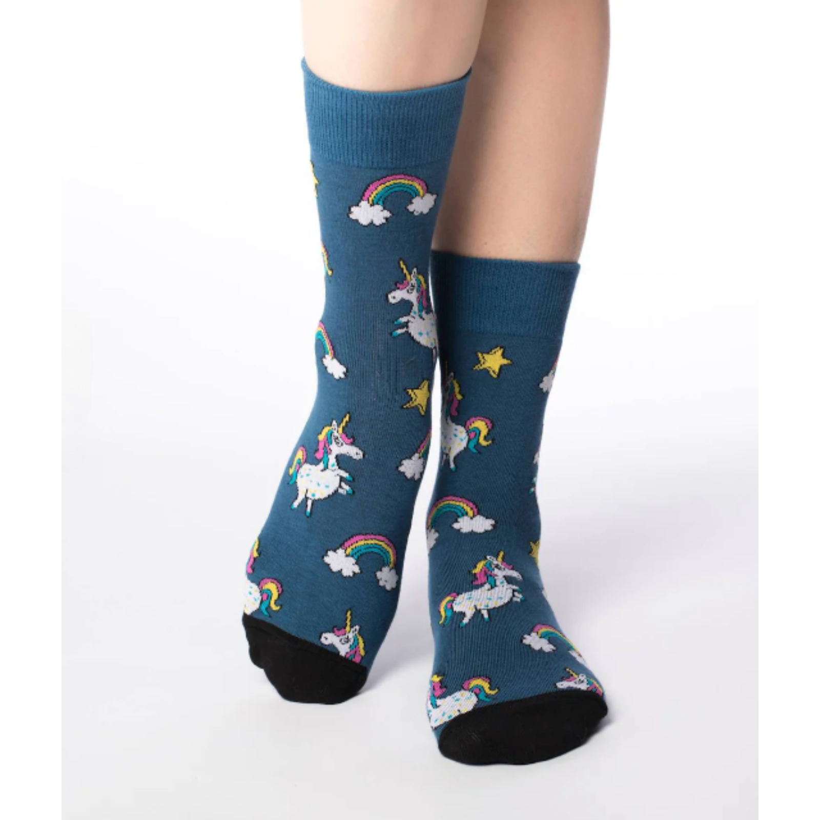 Good Luck Sock Unicorn women's crew sock featuring navy blue sock with cartoon unicorns and rainbows all over. Socks shown on model. 