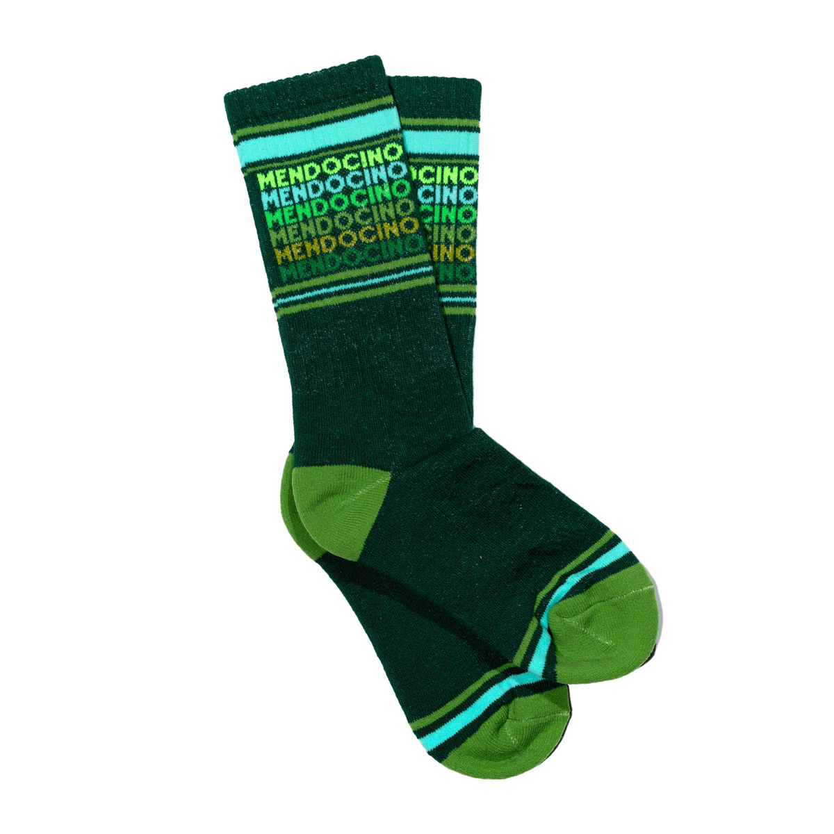 Gumball Poodle Mendocino women&#39;s and men&#39;s sock featuring &quot;Mendocino&quot; in green gradients on green sock on display foot