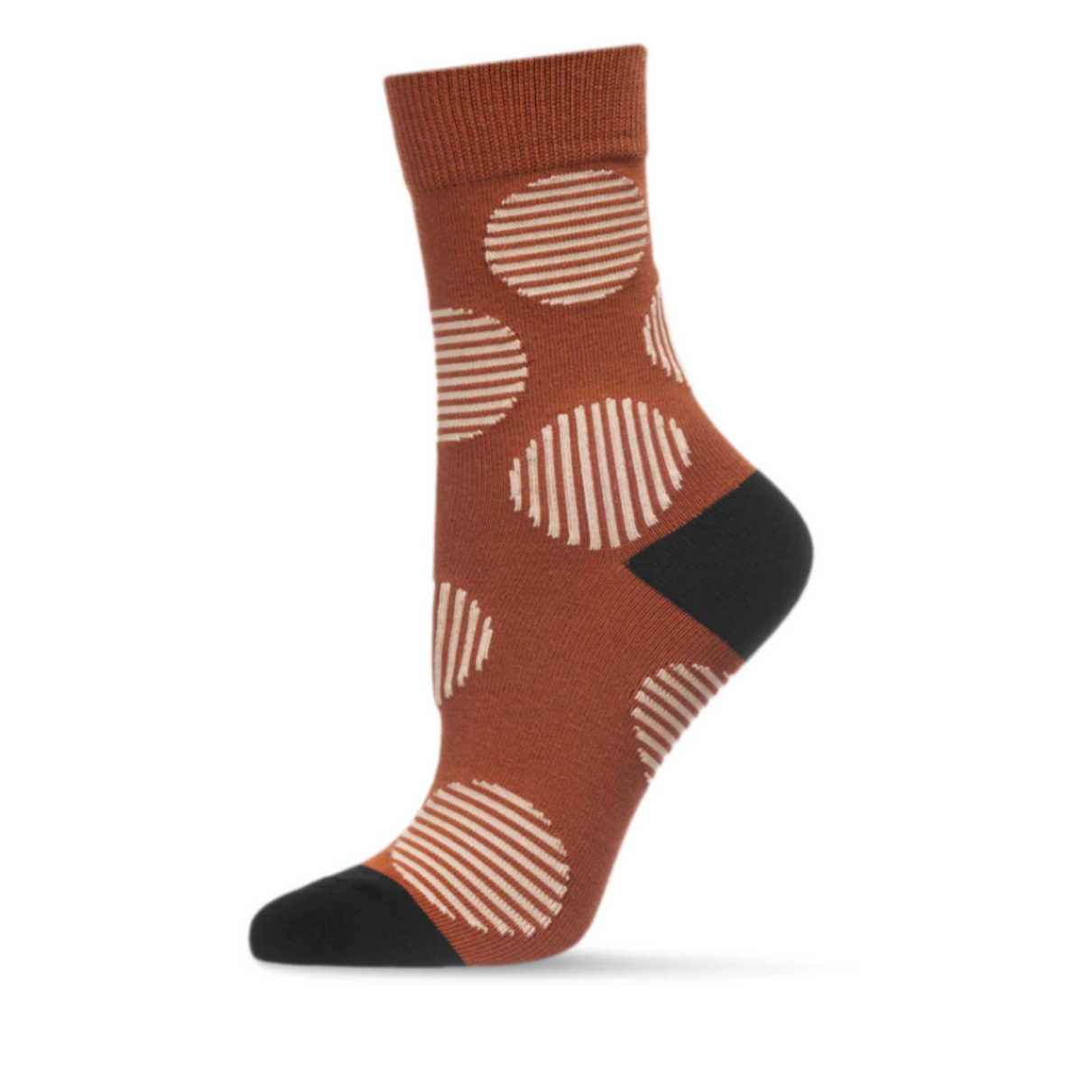 MeMoi Retro Circle women&#39;s Crew sock featuring brown sock with beige stripes in circle patterns all over. Socks shown on display foot from side.
