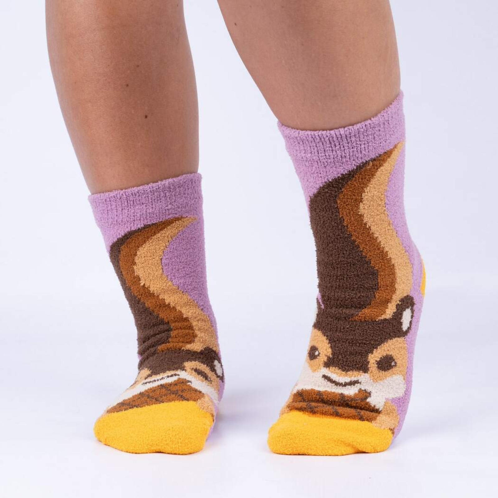 Sock It To Me I'm Nuts About You women's slipper sock featuring purple sock with image of squirrel and nut. Slipper socks shown on model. 
