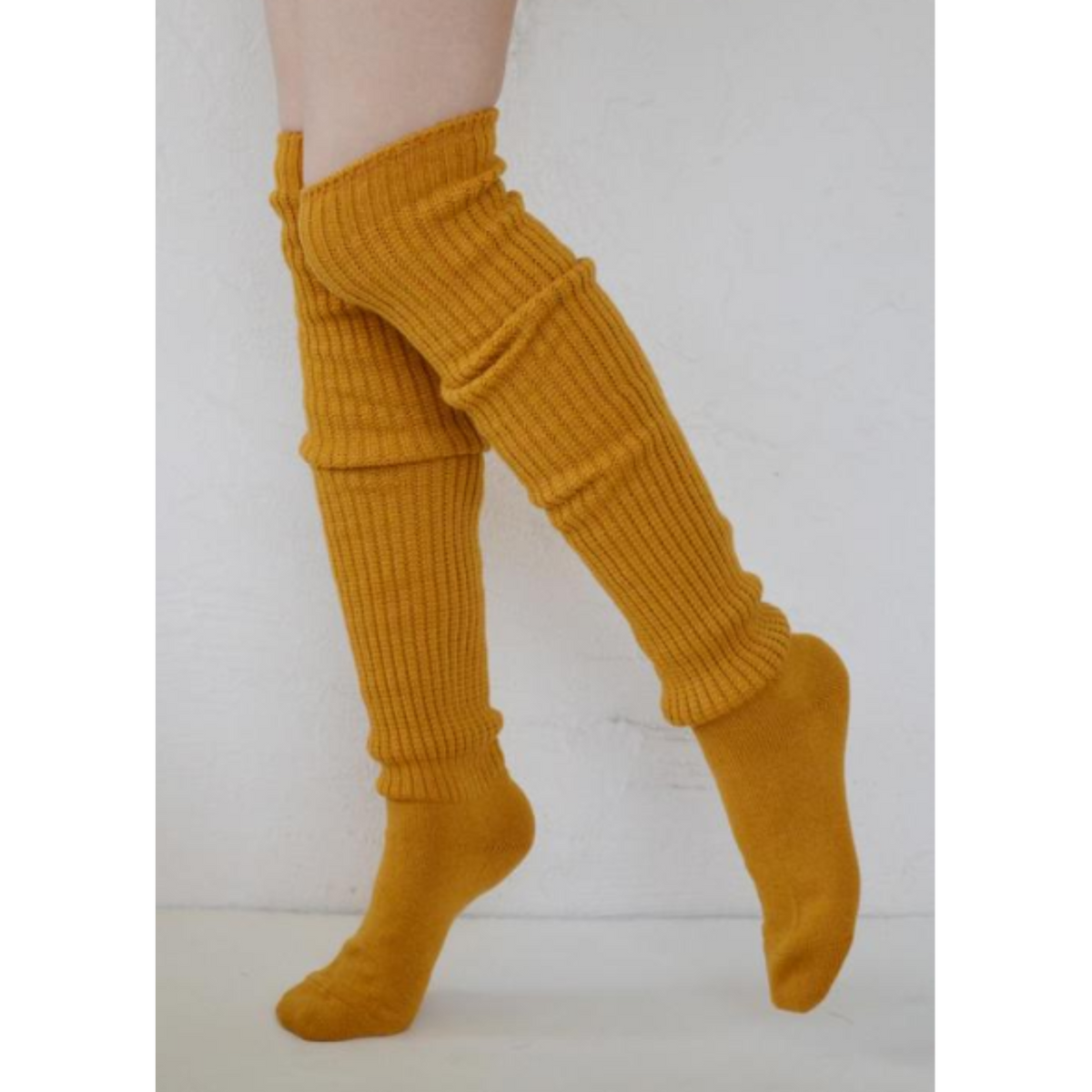 Tabbisocks Scrunchy Over the Knee women&#39;s socks shown in mustard color on model.