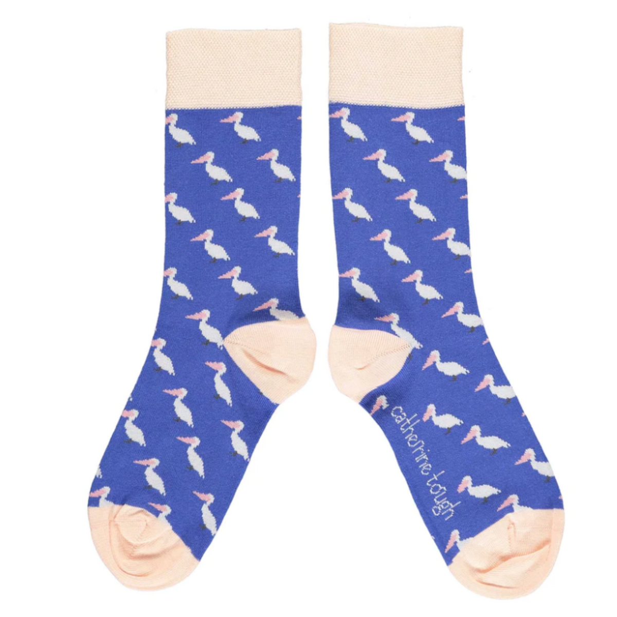 Catherine Tough Pelican blue women&#39;s crew sock featuring white pelicans with pink bills on green background with peach cuff, heel, and toe