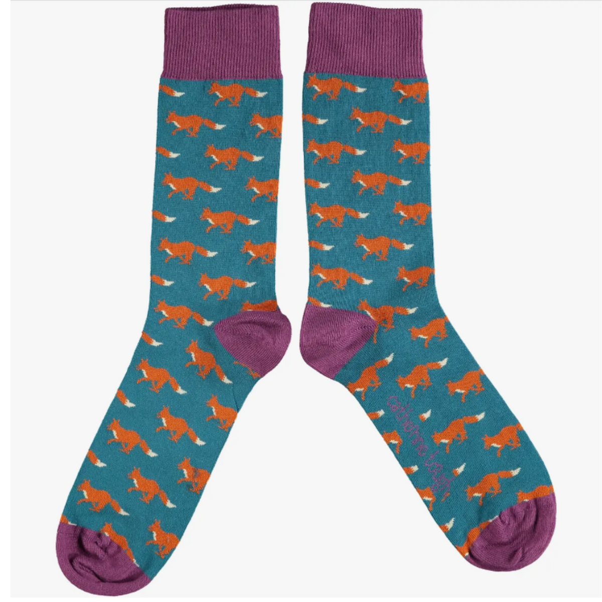 Catherine Tough men&#39;s fox socks design features red foxes on a teal base framed with purple cuffs, heels &amp; toes.