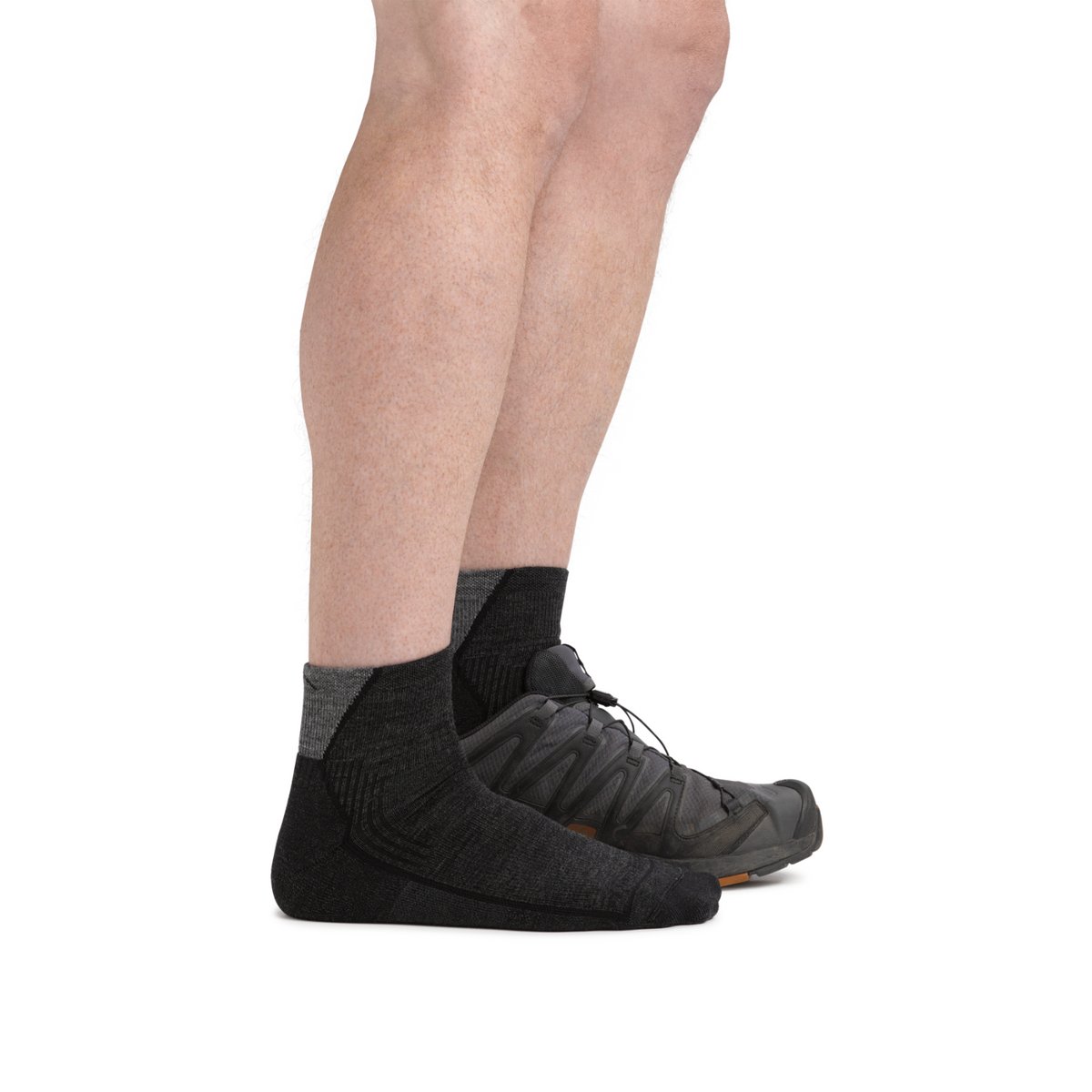 Darn Tough 1959 Quarter Height Midweight with Cushion Hike Men&#39;s Sock in black worn by model seen from the side