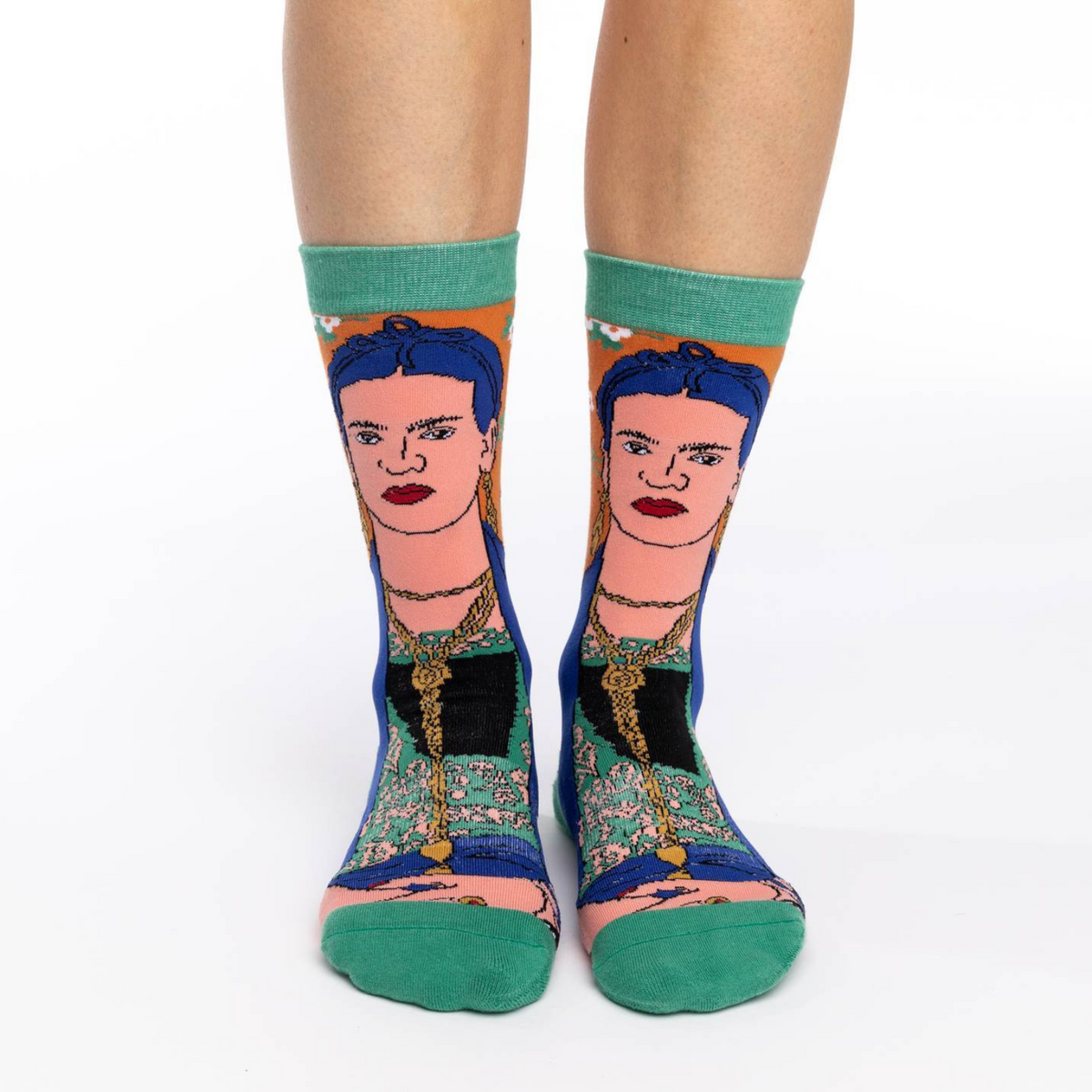 Good Luck Sock women&#39;s green crew sock featuring Frida Kahlo Self Portrait worn by model