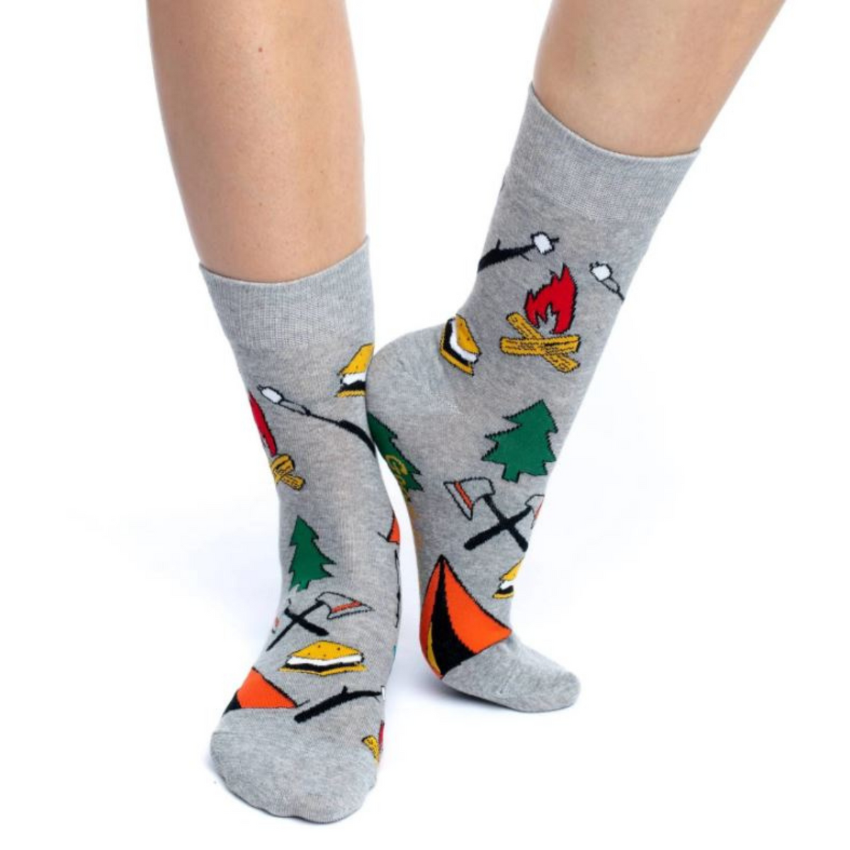 Good Luck Sock with images of Camping women&#39;s gray crew sock featuring tent, tree, smores, and campfire on model&#39;s feet