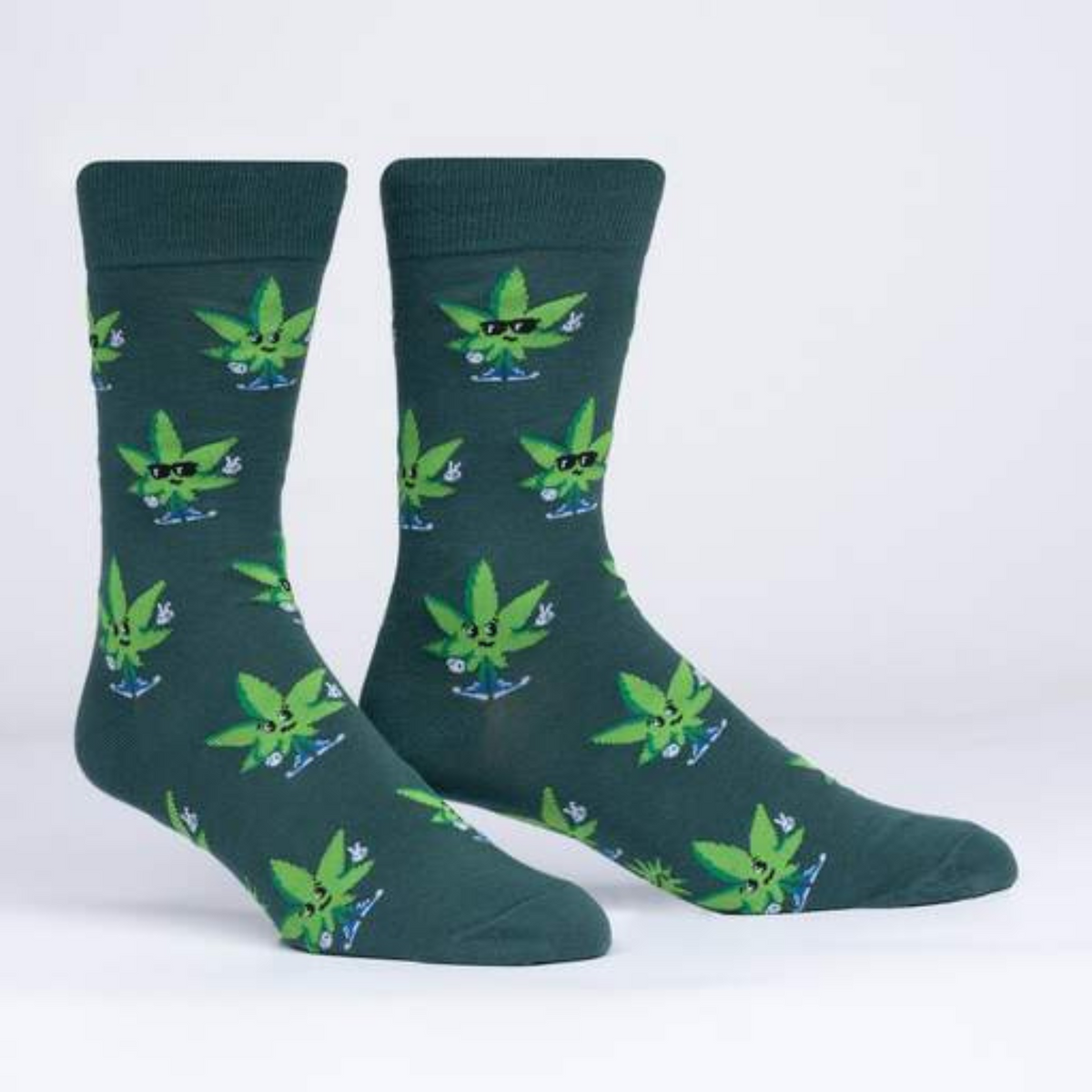Sock It To Me Peace Out men&#39;s sock featuring green sock with cannabis leaves on display feet