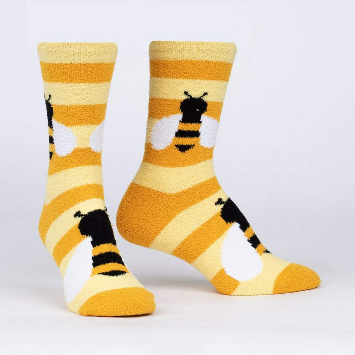 Sock It To Me Bee Cozy women&#39;s yellow stripe slipper sock featuring bees all over on display feet