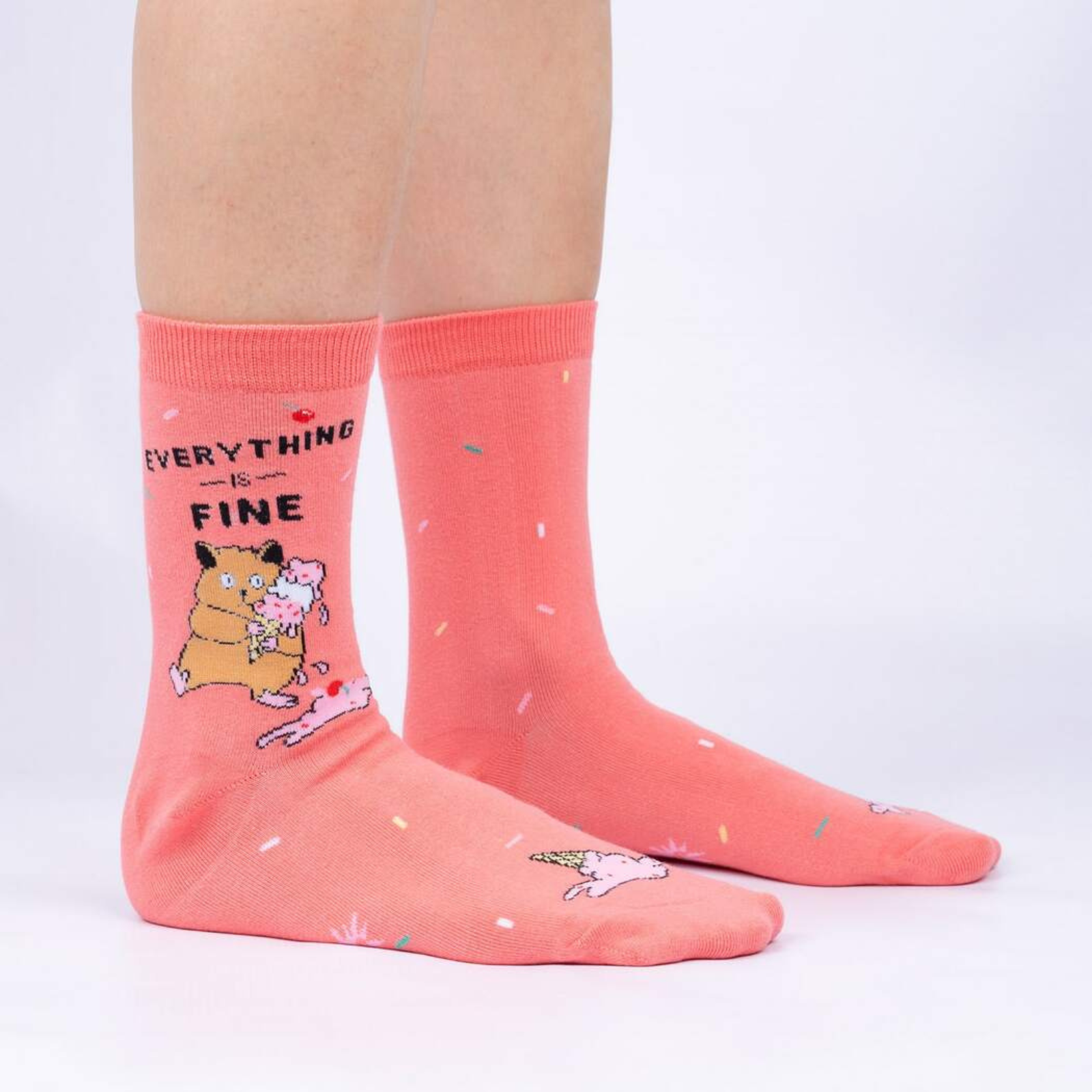Sock It To Me Everything is Fine women's pink crew sock featuring "Everything Is Fine" with hamster holding ice cream cone with dropped ice cream on model from side