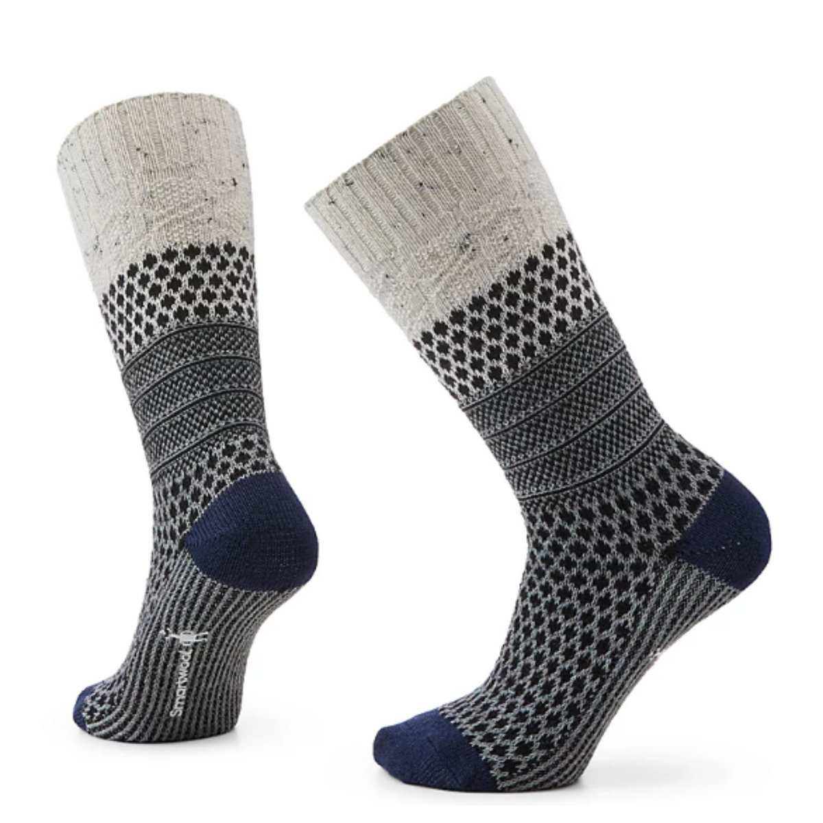 Smartwool Popcorn Cable Crew women&#39;s sock featuring heather gray colored cuff, and multiple shades of gray and black pattern on rest of sock, black toe and heel. Socks on display feet. 