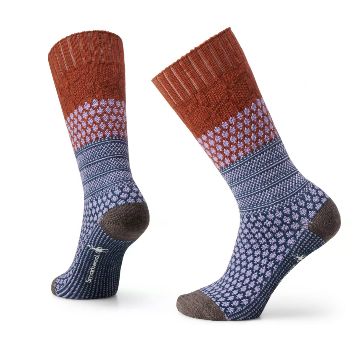 Smartwool Popcorn Cable Crew women&#39;s sock featuring rust colored cuff, and blue and lavender pattern on rest of sock. Socks on display feet. 