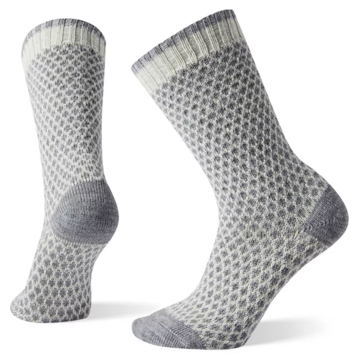Smartwool Popcorn Polka Dot Crew women&#39;s sock featuring white and gray pattern all over with gray toes and heel. Socks shown on display feet. 