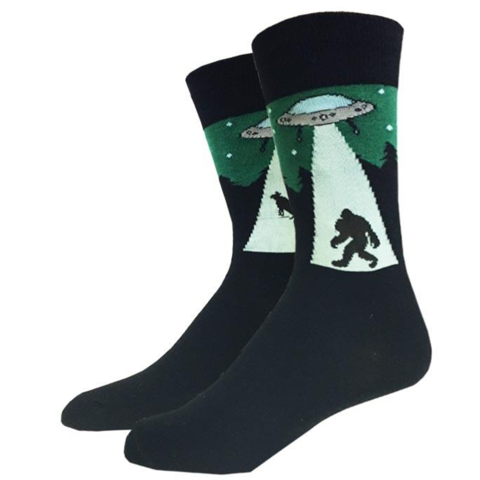 Sock Harbor UFO Bigfoot men's crew sock featuring black sock with image of UFO beaming up Sasquatch on one sock and beaming up a cow on the other. Socks shown on display feet. 