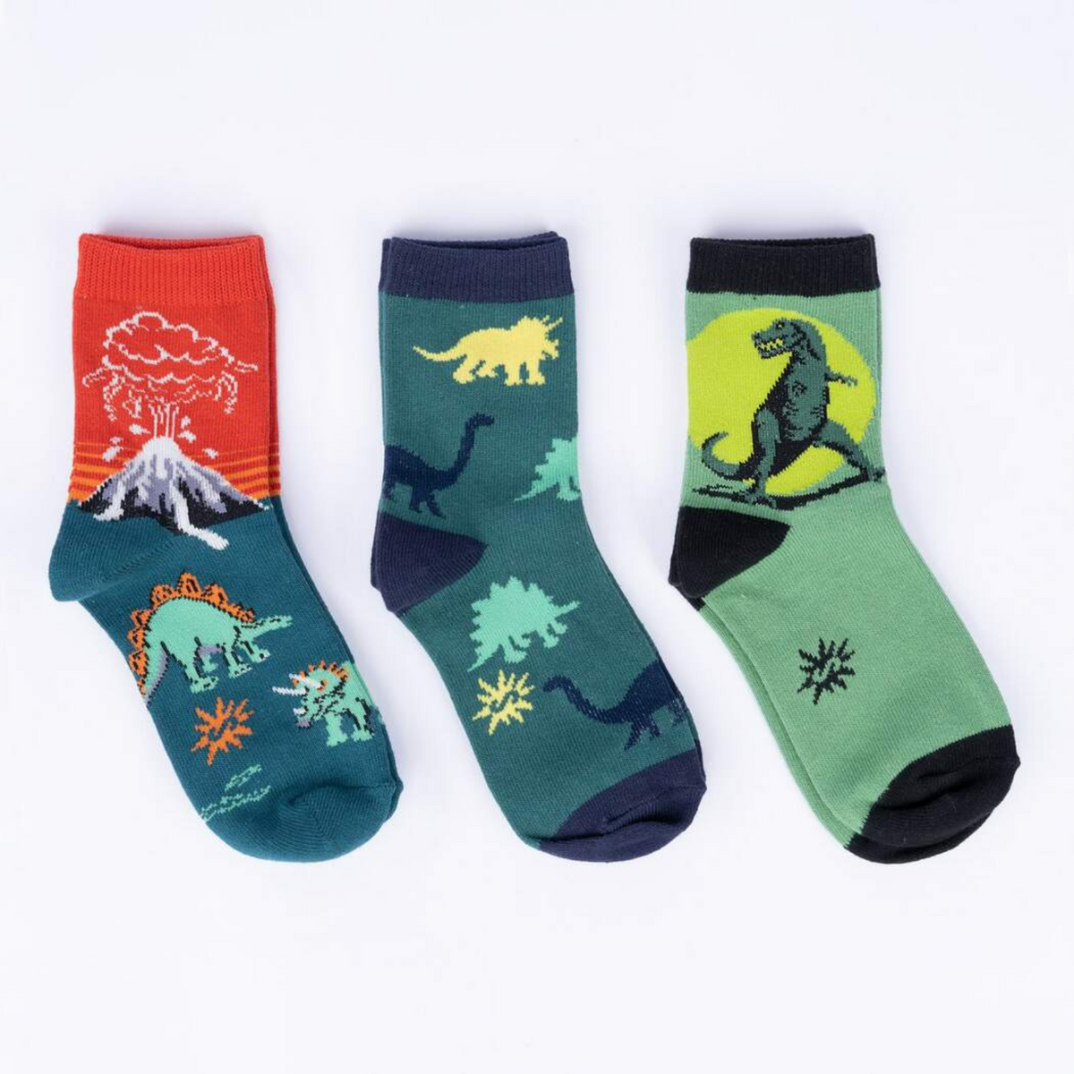 Sock It To Me Dinosaur Days 3-pack kids&#39; crew socks (GLOWS IN THE DARK!) featuring three styles of dinosaur-themed socks on display