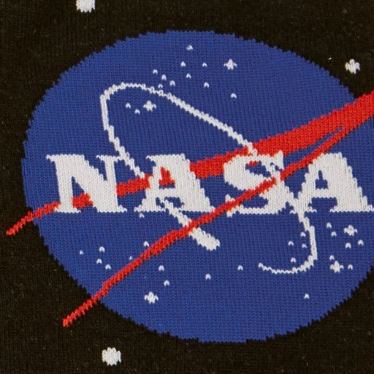 Detail of Sock It To Me NASA Solar System men&#39;s crew socks featuring black sock with NASA logo and planets all over.