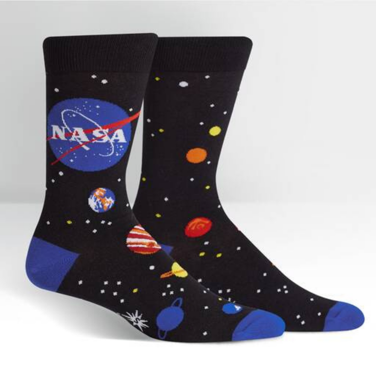 Sock It To Me NASA Solar System men&#39;s crew socks featuring black sock with NASA logo and planets all over. Socks shown on display feet. 