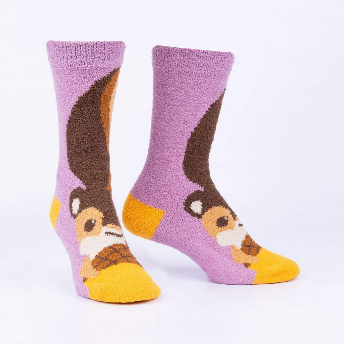 Sock It To Me I&#39;m Nuts About You women&#39;s slipper sock featuring purple sock with image of squirrel and nut. Slipper socks shown on display feet.. 