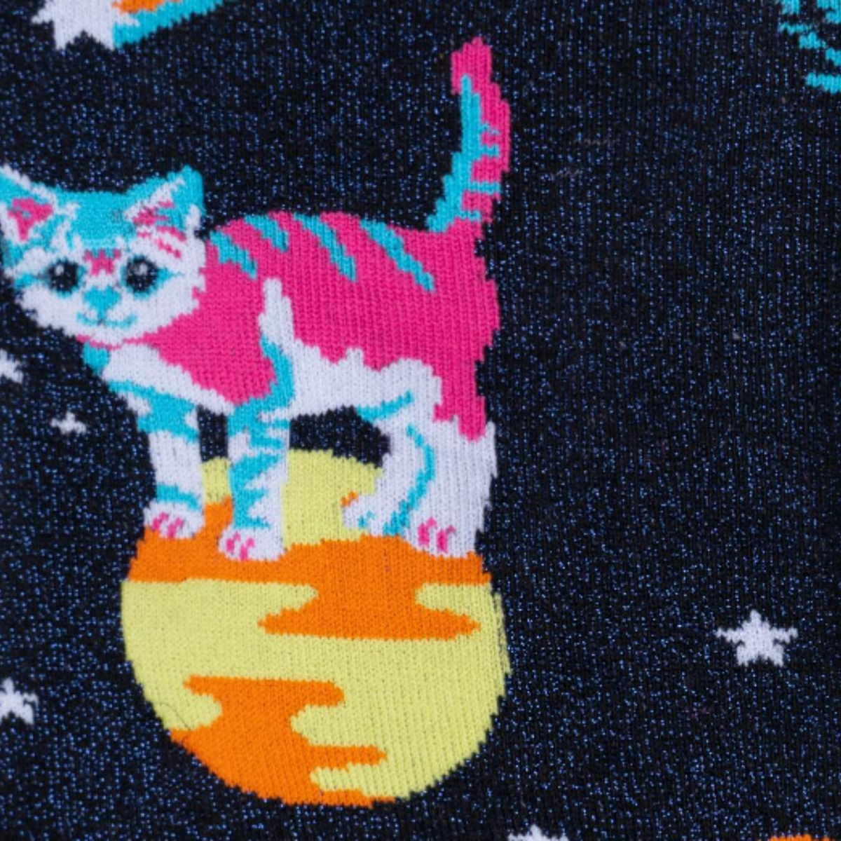 Detail of Sock It To Me Space Cats extra-stretchy knee sock featuring pink toe and heel with shimmery black background and kittens in outer space. 