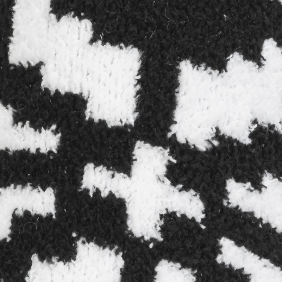 Detail of Sock It To Me You Sweater Believe It women&#39;s slipper sock featuring black fair isle pattern. 