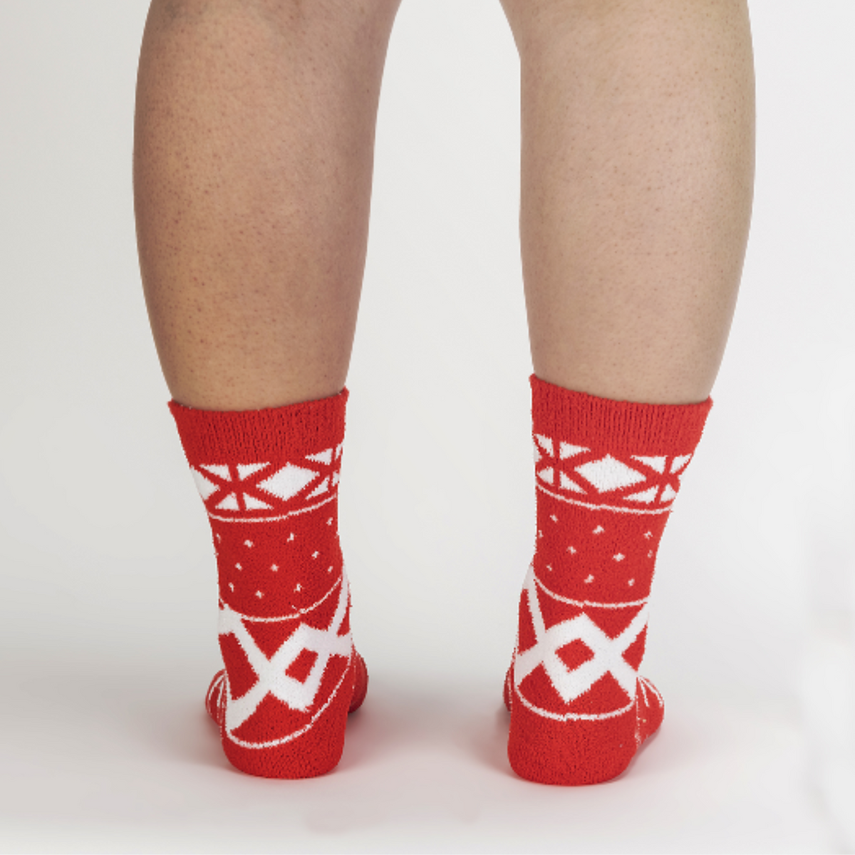Sock It To Me You Sweater Believe It women&#39;s slipper sock featuring red fair isle pattern. Socks worn by model seen from behind.. 