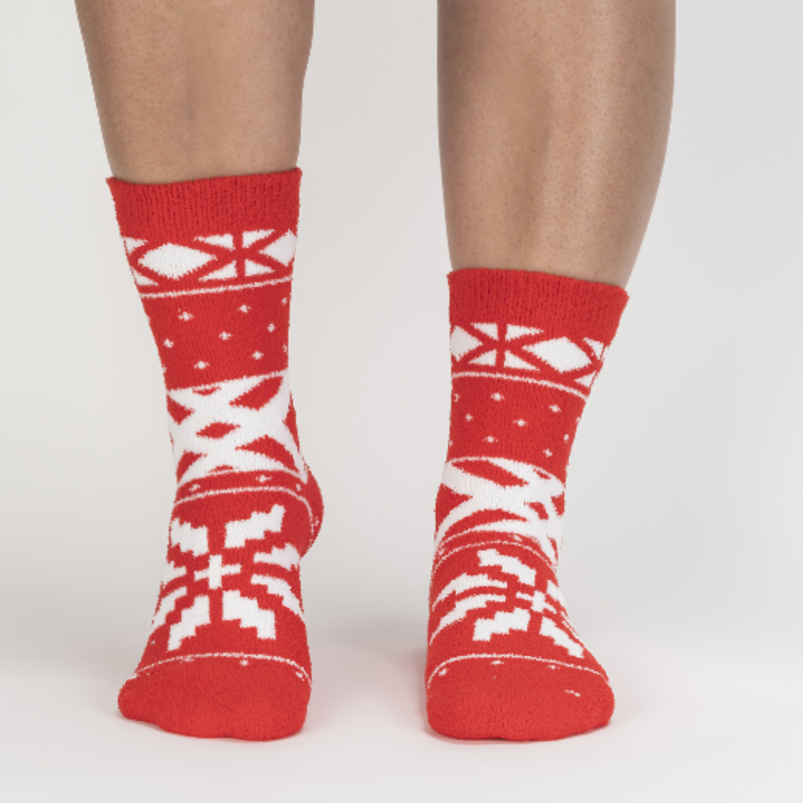 Sock It To Me You Sweater Believe It women's slipper sock featuring red fair isle pattern. Socks worn by model seen from front. 