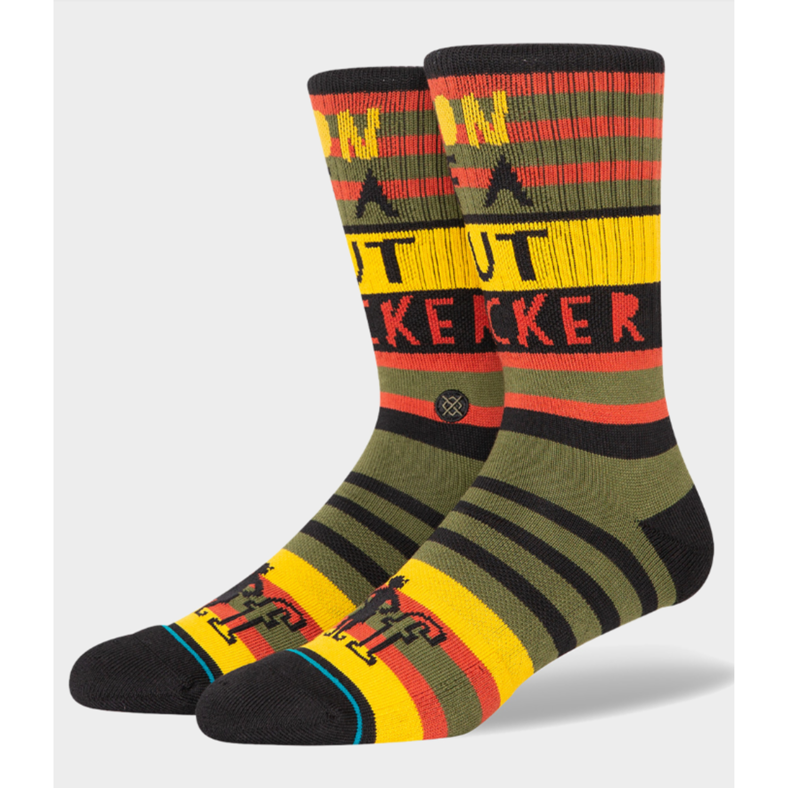 Stance Son of a Nutcracker men's crew sock featuring "Son of A Nutcracker" from the movie Elf on green, red, yellow, and black striped socks. Socks shown on display feet. 