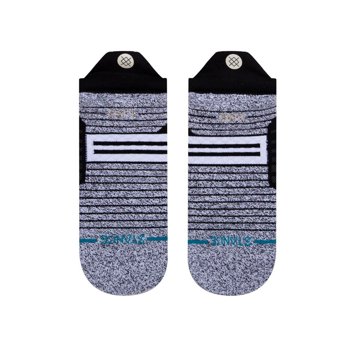 Stance Versa Tab women&#39;s and men&#39;s sock featuring black no-show sock with gray bottom. Shown on display feet from bottom. 