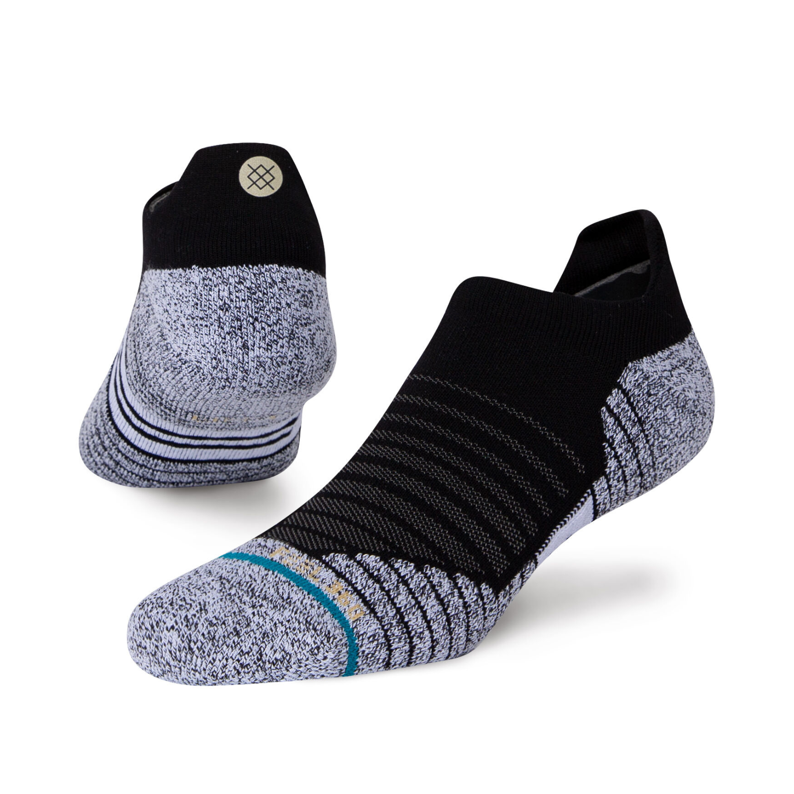 Stance Versa Tab women's and men's sock featuring black no-show sock with gray bottom. Shown on display feet from side and back. 