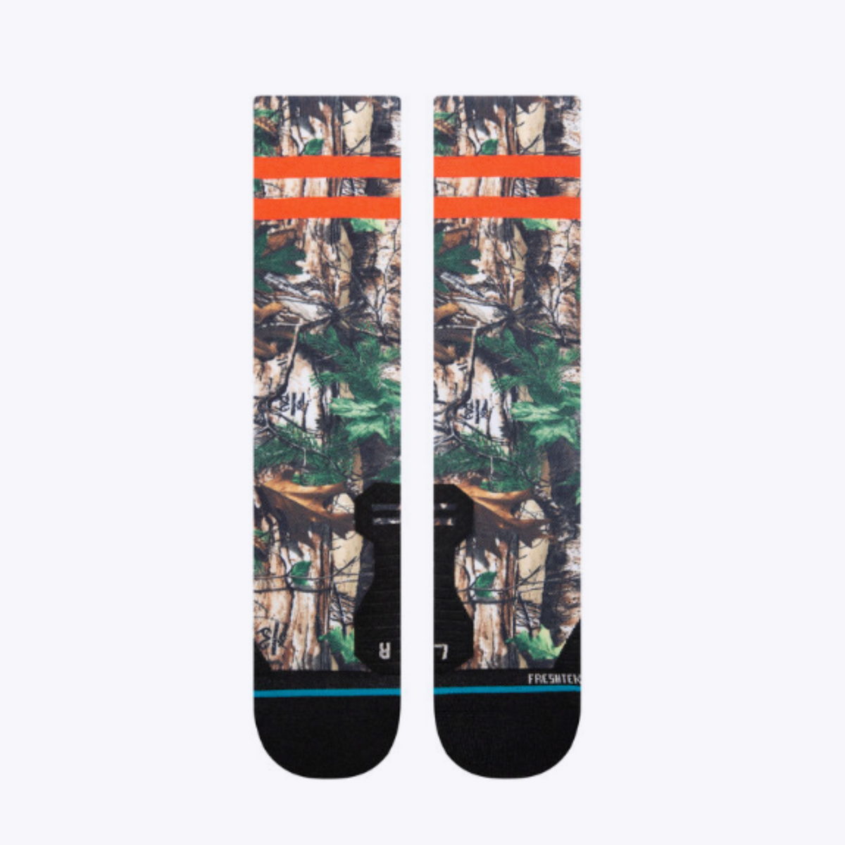 Top of Stance Xtra Light Xtra Performance men&#39;s crew sock featuring all-over camouflage pattern and two orange stripes at top. 