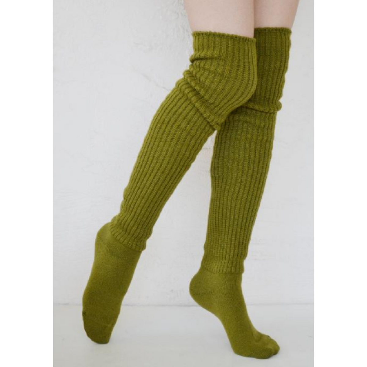Tabbisocks Scrunchy Over the Knee women&#39;s socks shown in green tea color on model.