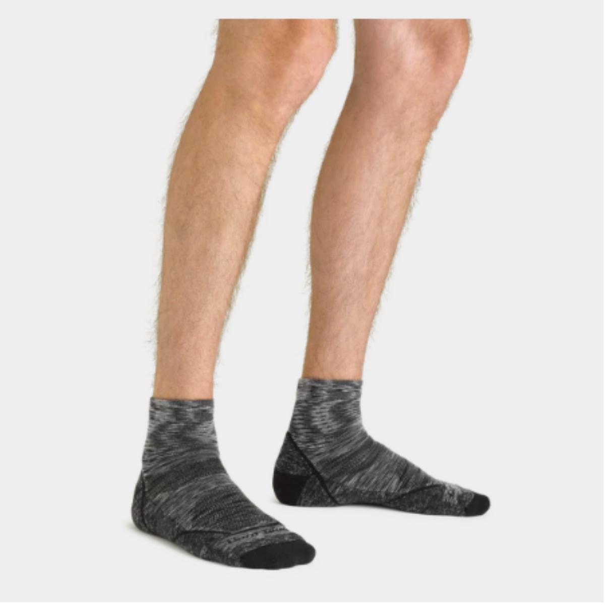 Darn Tough 1991 Quarter Height Lightweight Hike men&#39;s sock in space gray on a model from the knee down