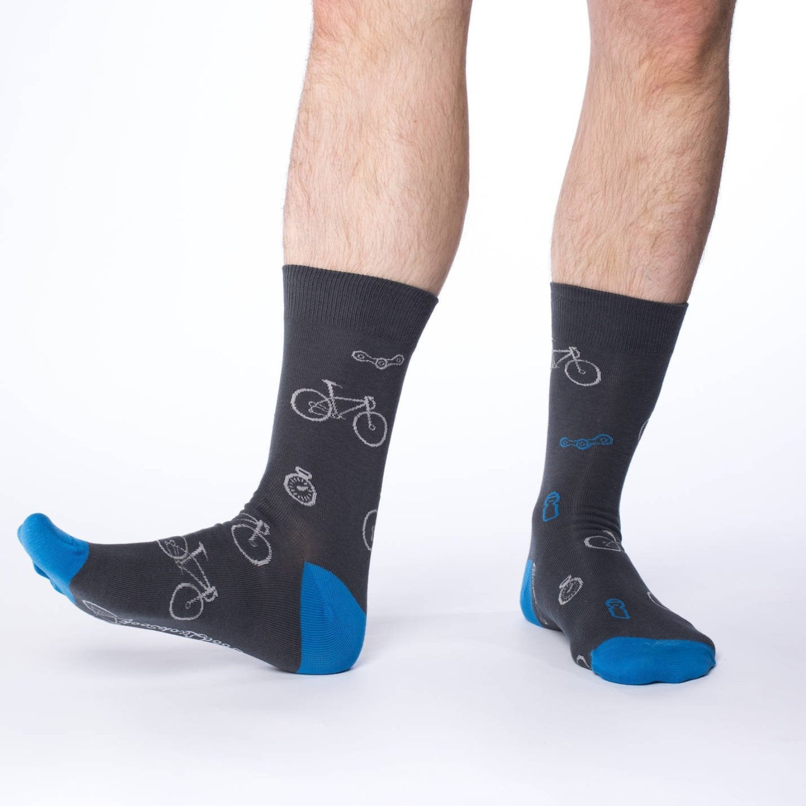 Good Luck Sock Blue and Grey Bicycle men's sock featuring gray sock with blue heel and toes with white bicycles on male model