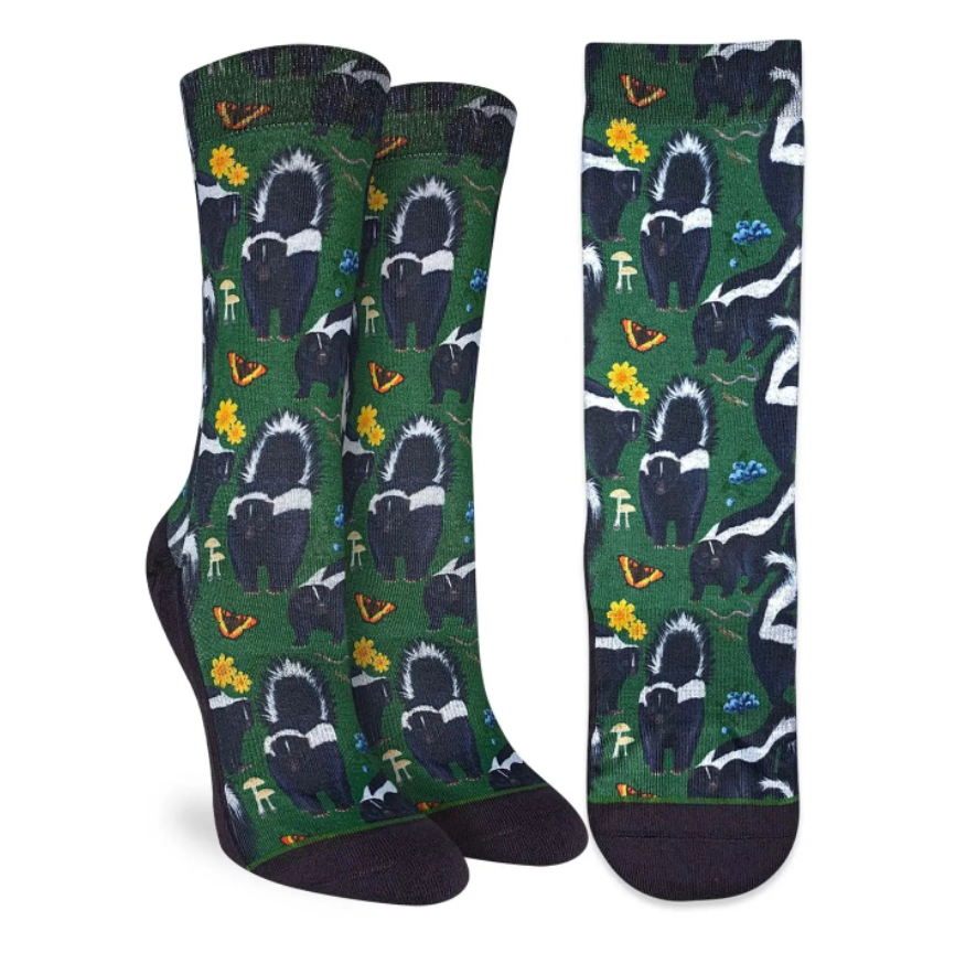 Good Luck Sock women's green crew sock with skunks all over on display feet