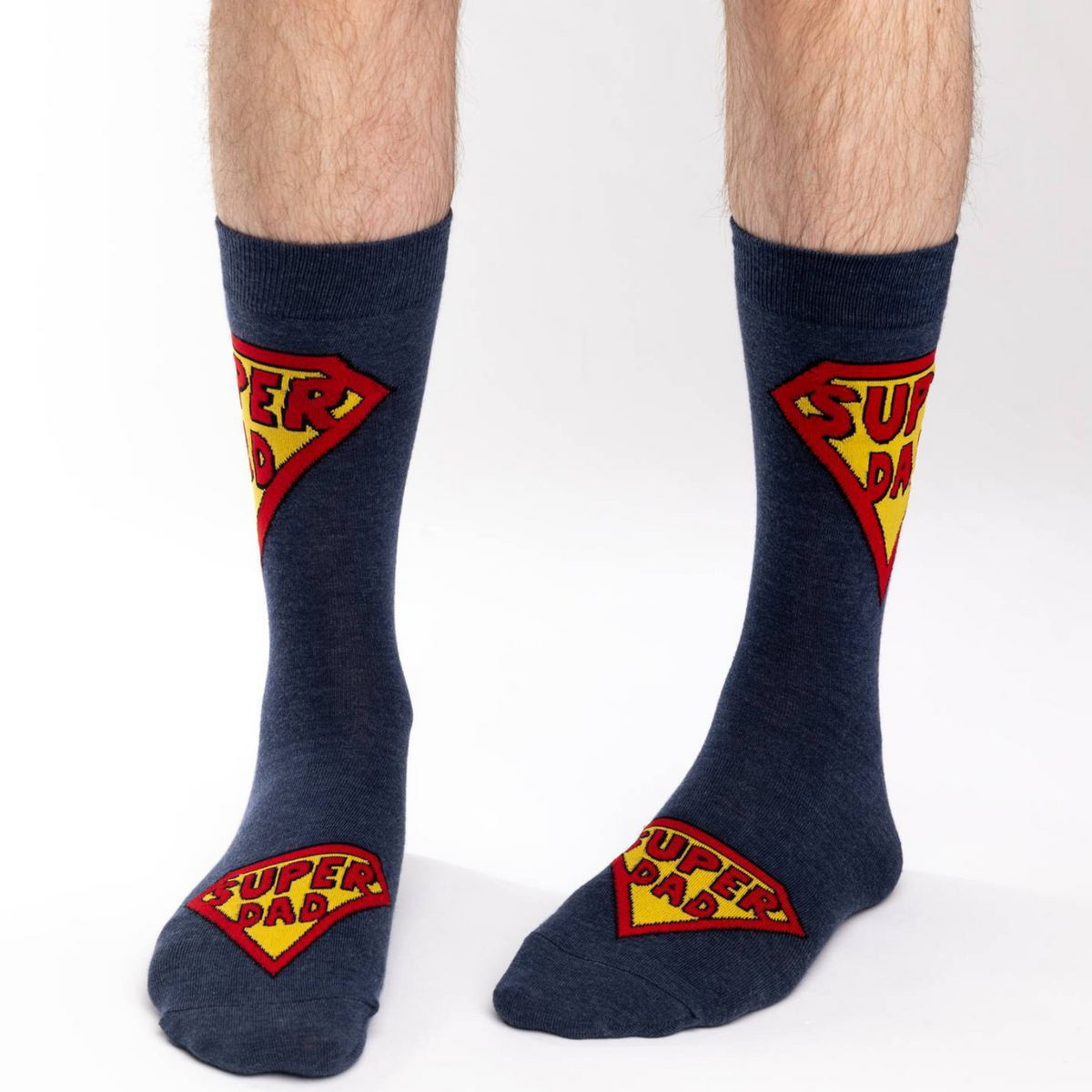 Good Luck Sock blue crew men&#39;s sock with Super Dad written on them on model&#39;s feet