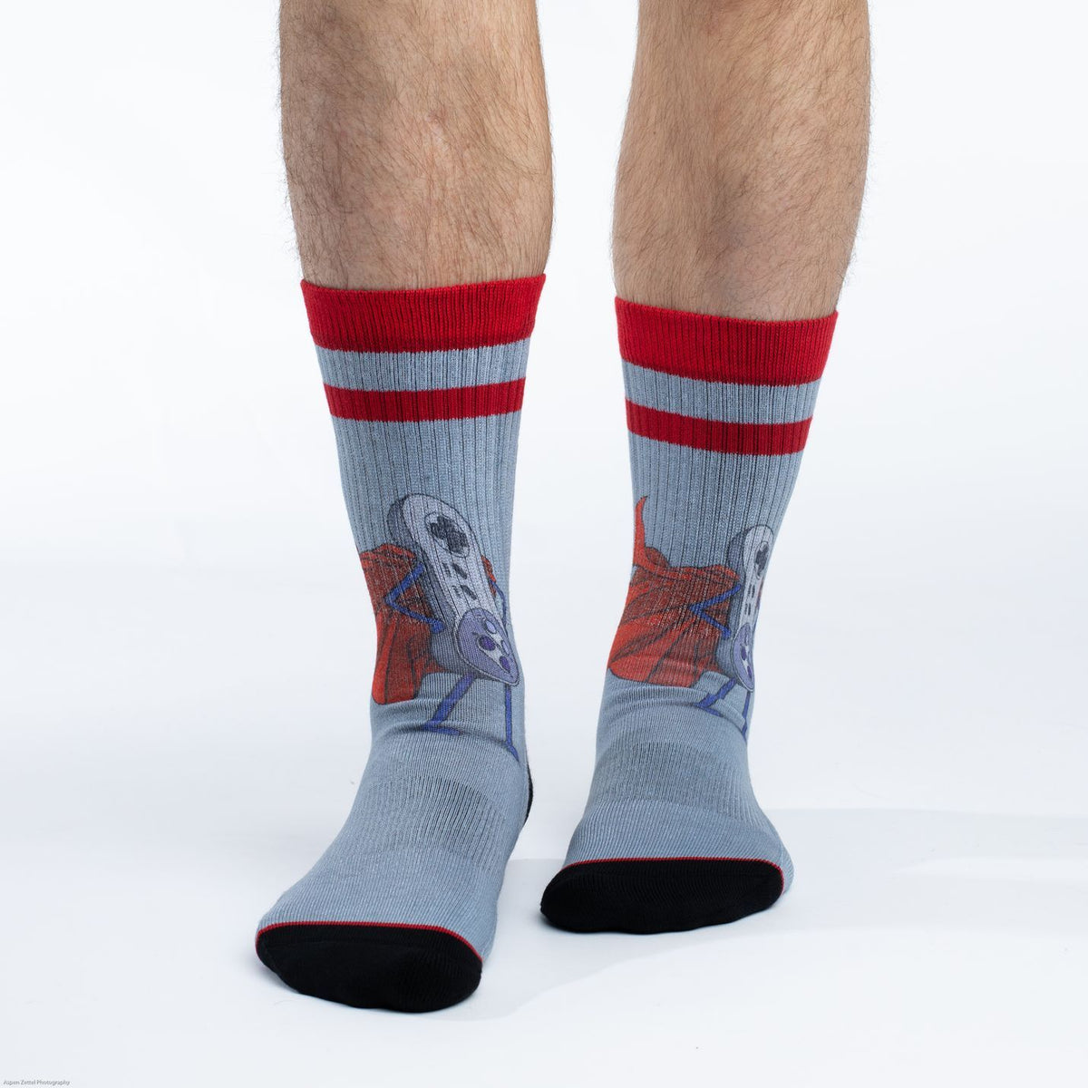 Good Luck Sock Super NES men&#39;s sock featuring NES controller with cape on gray sock worn by male model