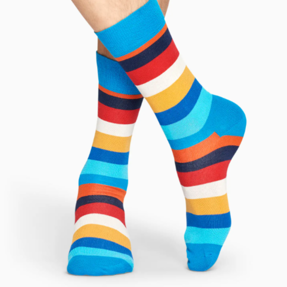 Happy Socks Stripe Blue men&#39;s sock modeled from front showing multi-color striped socks with blue cuff, heel and toe