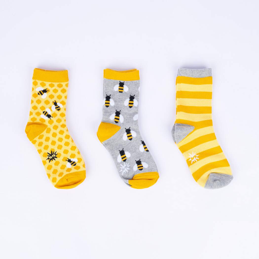 Three pair of kid Sock It To Me Socks with bees and yellow stripes