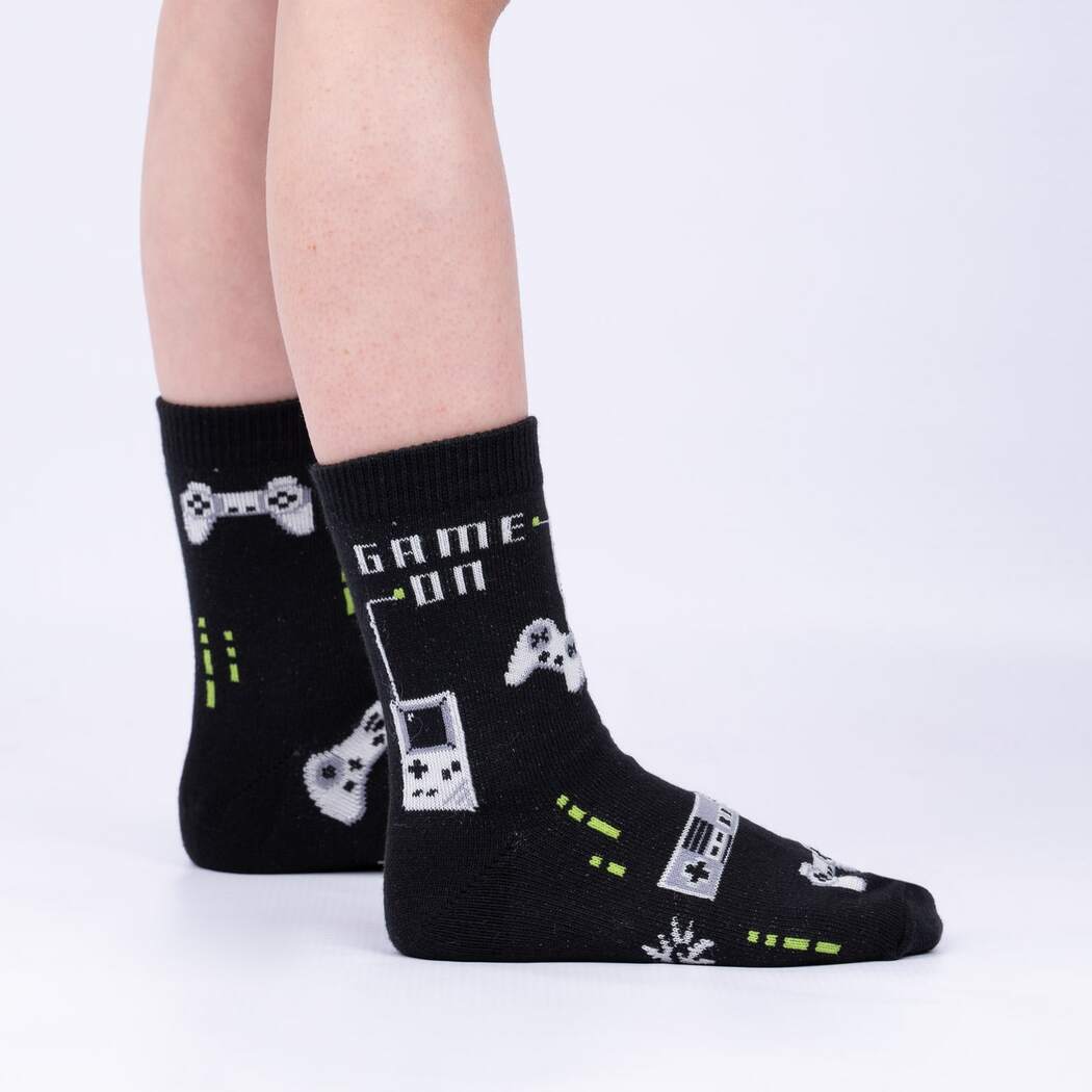 Sock It To Me black child glow in the dark sock with video-game controllers