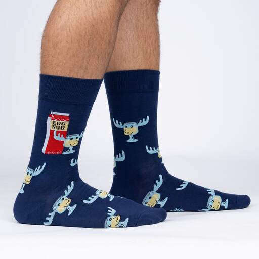 Sock It To Me Hey Kids! Look! A Moose! men's crew sock featuring blue sock with Egg Nog and glass with moose antlers. Socks shown on model from the side. 