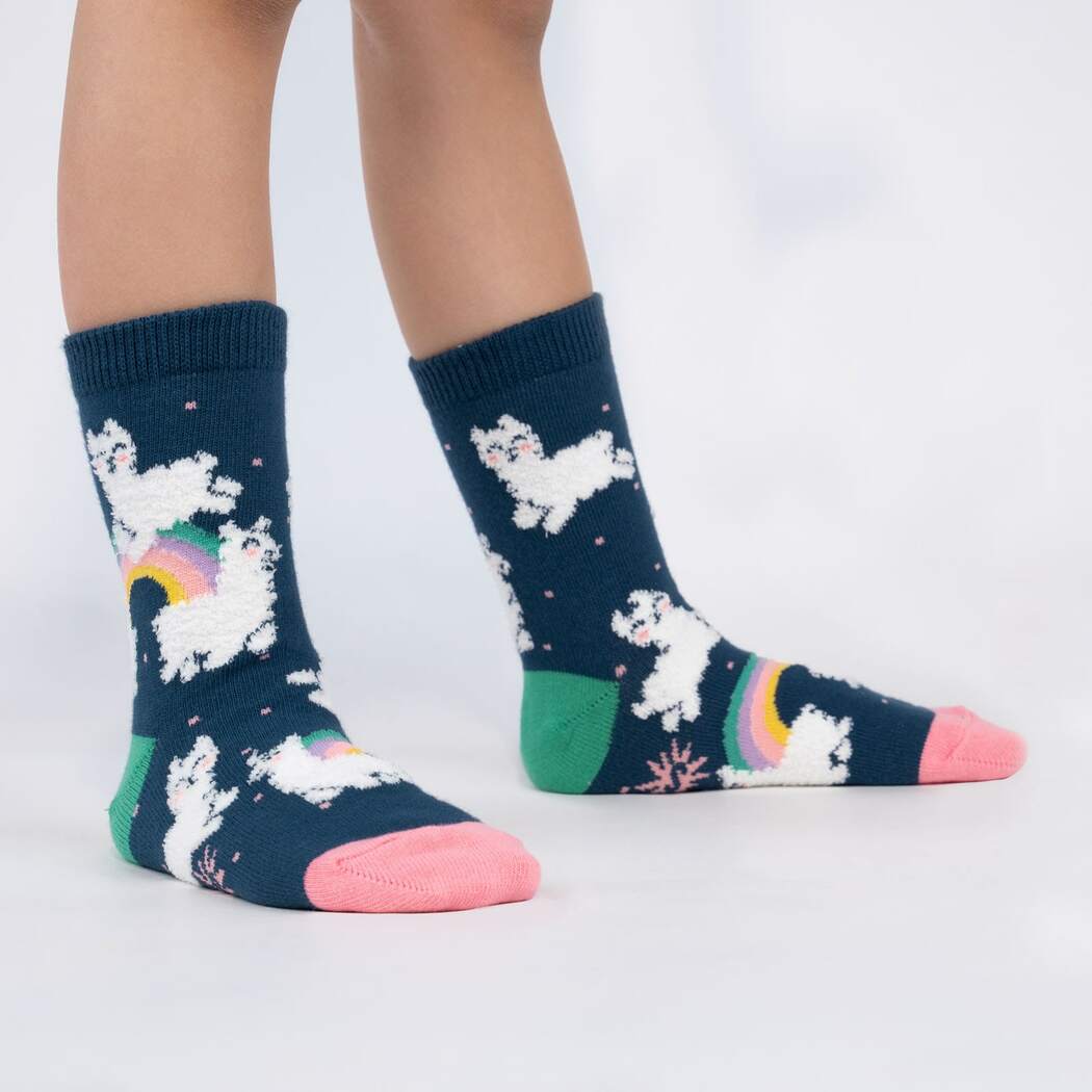 Sock It To Me child blue sock with llama leaping over rainbows