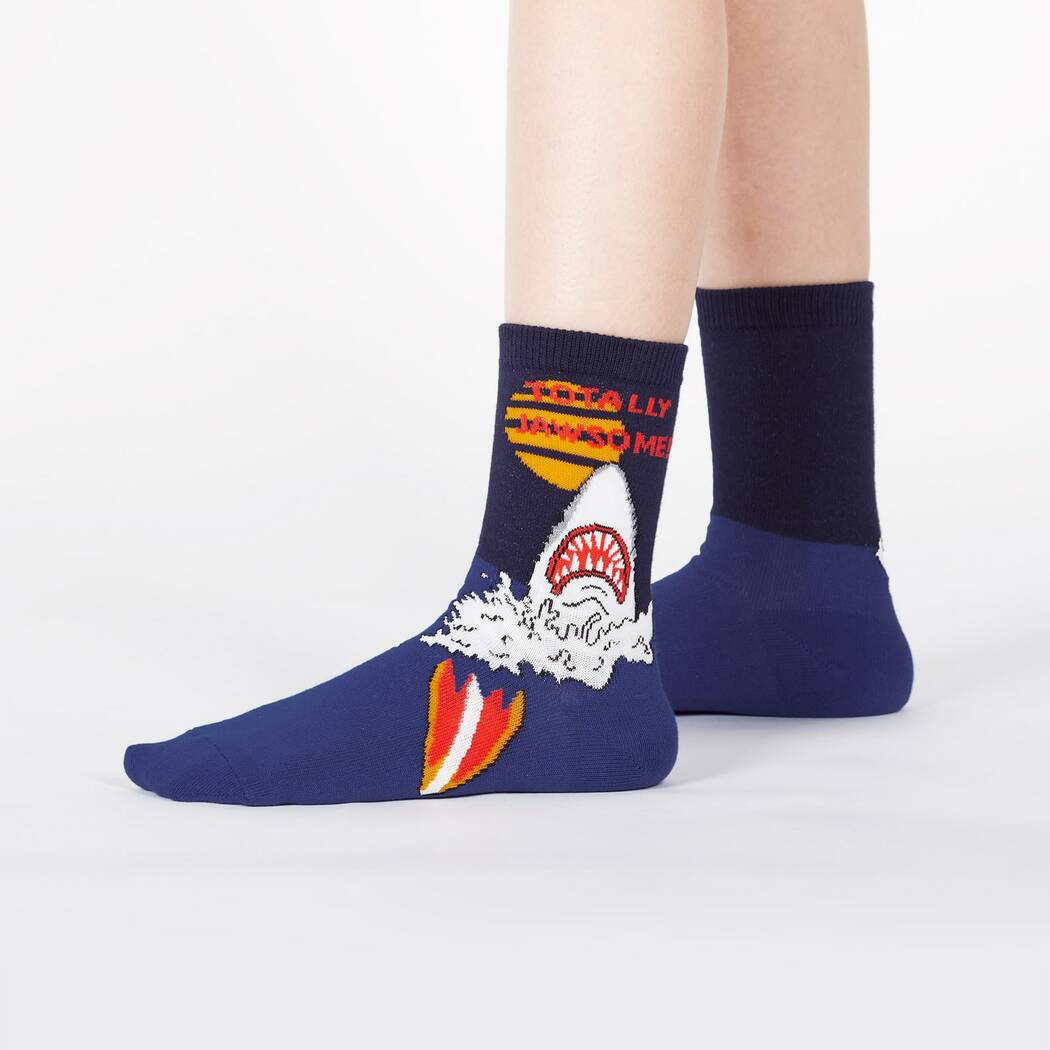 Child pair of blue Sock It To Me Socks that say Totally Jawsome