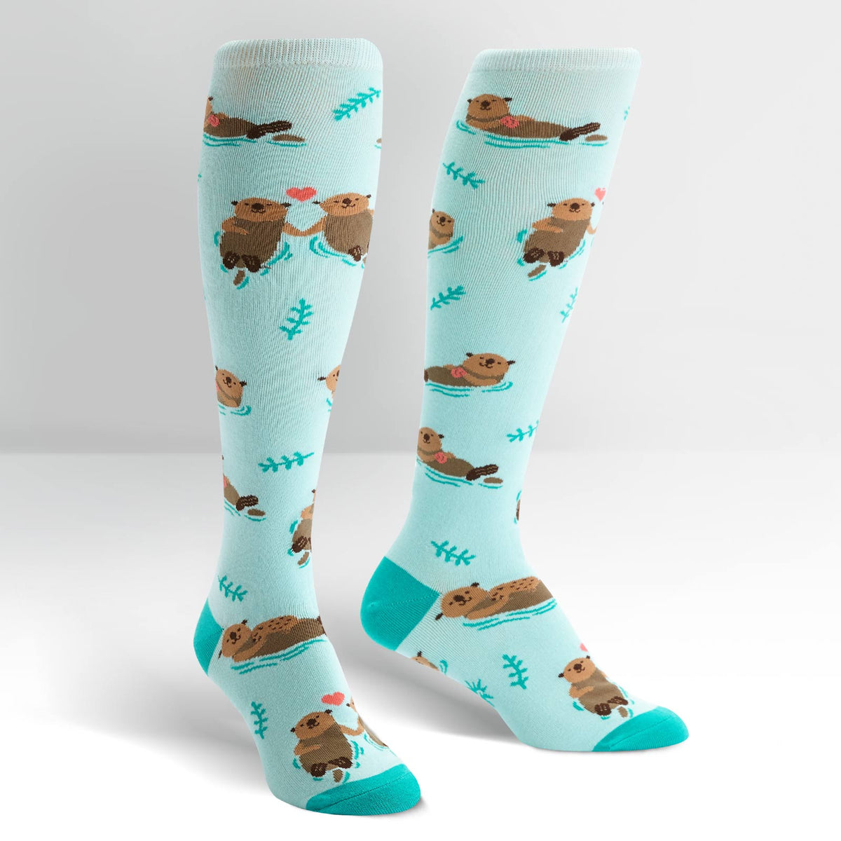 Sock It To Me My Otter Half women&#39;s socks on display feet showing otters in ocean 